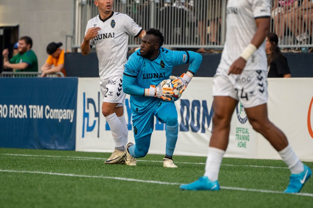 Las Vegas Lights FC goalkeeper Raiko Arozarena holding a soccer ball.