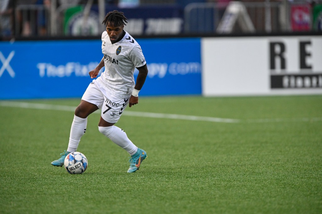 Las Vegas Lights FC forward Joe Gyau dribbling a soccer ball