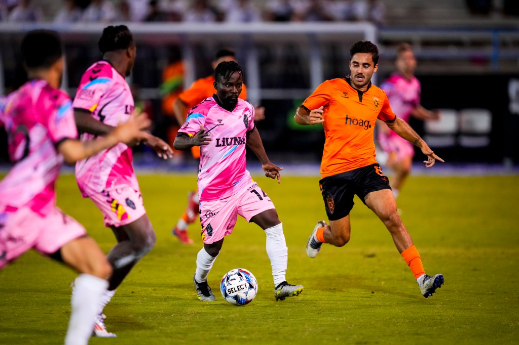 Las Vegas Lights FC forward Soloman Asante dribbling down the field